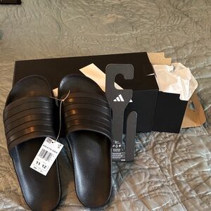 Adilette Aqua slides.